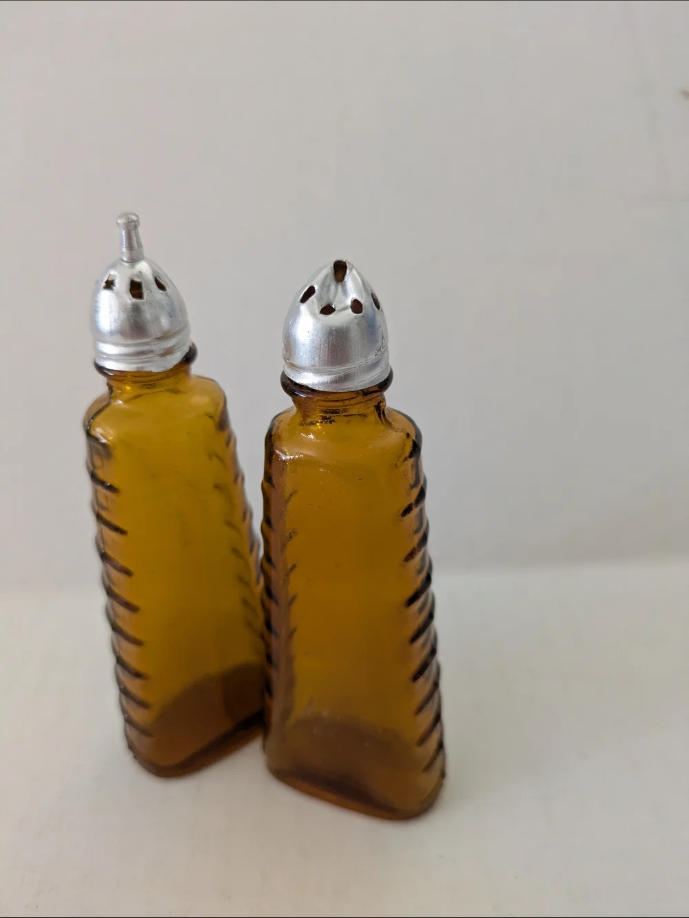 Amber Glass Salt and Pepper Shakers with Silver Tops. Made In Taiwan